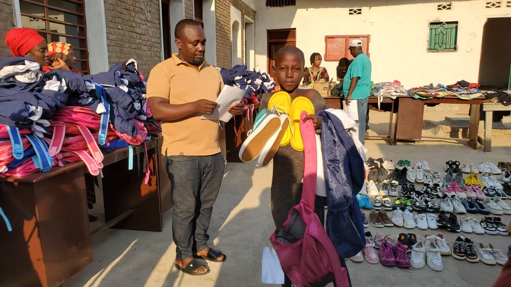 Volunteers distributing school supplies